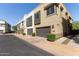 A row of modern townhomes featuring neutral colors, individual garages, and well-maintained landscaping at 7324 E Vista Bonita Dr, Scottsdale, AZ 85255