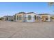 Exterior view of a new construction home with stone and stucco, offering modern design at 8230 N Mockingbird Ln, Paradise Valley, AZ 85253