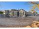 Side exterior of home under construction, featuring modern design and desert surroundings at 8230 N Mockingbird Ln, Paradise Valley, AZ 85253