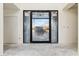 Bright living room space with large glass doors, ready for finishing touches at 8230 N Mockingbird Ln, Paradise Valley, AZ 85253