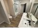 Contemporary bathroom featuring double sinks, white countertops, and modern fixtures at 8833 N 39Th Ave, Phoenix, AZ 85051