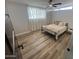 Bedroom with updated flooring and ceiling fan providing natural light at 8833 N 39Th Ave, Phoenix, AZ 85051