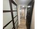 Hallway with contemporary sliding doors leading to other rooms at 8833 N 39Th Ave, Phoenix, AZ 85051