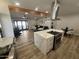 Open-concept kitchen with a large island, stainless steel appliances, and modern finishes at 8833 N 39Th Ave, Phoenix, AZ 85051