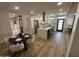 Modern kitchen with a quartz island, stainless steel appliances, and an adjacent dining area at 8833 N 39Th Ave, Phoenix, AZ 85051