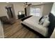 Spacious main bedroom with backyard access, an accent wall, and ample natural light at 8833 N 39Th Ave, Phoenix, AZ 85051