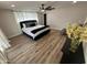 Bright and airy main bedroom with a large window, ceiling fan, and neutral color palette at 8833 N 39Th Ave, Phoenix, AZ 85051