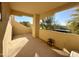 A view of a covered balcony with outside scenery including trees and sky at 9065 E Gary Rd # 129, Scottsdale, AZ 85260