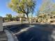 View of the community gate with an attractive wrought iron fence providing security in a manicured setting at 9065 E Gary Rd # 129, Scottsdale, AZ 85260