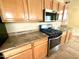 Updated kitchen with stainless steel appliances, granite countertops, and plenty of storage at 9065 E Gary Rd # 129, Scottsdale, AZ 85260