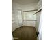 Walk-in closet with multiple shelves and rods, offering ample storage space at 9065 E Gary Rd # 129, Scottsdale, AZ 85260