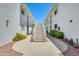 Apartment building exterior with white painted brick and stairs leading to the upper levels at 920 N 82Nd N St # H203, Scottsdale, AZ 85257