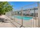 Fenced community pool with clear blue water, offering a refreshing amenity for residents at 920 N 82Nd N St # H203, Scottsdale, AZ 85257