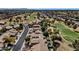 An aerial view of a golf course community featuring beautiful homes, landscaping, and views at 1054 S Butte Ln, Gilbert, AZ 85296