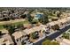 An aerial view of a residential area next to a golf course, showcasing houses with desert landscaping at 1054 S Butte Ln, Gilbert, AZ 85296