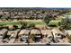 Aerial view of a neighborhood lined with houses on a golf course at 1054 S Butte Ln, Gilbert, AZ 85296
