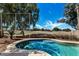 A refreshing pool offers golf course views and a fenced yard to promote the ultimate relaxation and privacy at 1054 S Butte Ln, Gilbert, AZ 85296
