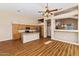Open concept kitchen with an island, stainless steel appliances, and hardwood floors at 1054 S Butte Ln, Gilbert, AZ 85296