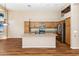 A kitchen featuring wood cabinets, granite countertops and stainless steel appliances and island sink at 1054 S Butte Ln, Gilbert, AZ 85296