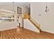Spacious living room featuring hardwood floors, a staircase, and natural lighting at 1054 S Butte Ln, Gilbert, AZ 85296