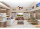 Bright living room featuring multiple windows, a ceiling fan, and neutral decor at 1054 S Butte Ln, Gilbert, AZ 85296