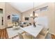 Open concept living room and dining area with neutral decor and vaulted ceilings at 1054 S Butte Ln, Gilbert, AZ 85296