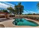 Backyard pool with a view of the green golf course in the distance at 1054 S Butte Ln, Gilbert, AZ 85296