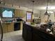 Traditional kitchen features an island, tile floors and a window over the sink at 11371 N Rhodes Ct, Valley Farms, AZ 85191