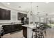 Kitchen featuring an island with barstool seating and modern appliances at 11509 W Boca Raton Rd, El Mirage, AZ 85335