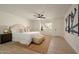Spacious main bedroom with a neutral color palette, ceiling fan and a window seat at 120 W Thunderbird Rd, Phoenix, AZ 85023