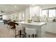 Eat-in kitchen with quartz countertops, white cabinets and stainless steel appliances at 120 W Thunderbird Rd, Phoenix, AZ 85023
