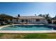Backyard pool with tanning ledge and patio furniture in a well landscaped backyard at 120 W Thunderbird Rd, Phoenix, AZ 85023