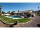 Backyard pool with well-maintained landscaping and patio furniture, perfect for outdoor entertaining at 120 W Thunderbird Rd, Phoenix, AZ 85023