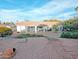 Spacious backyard featuring a covered patio and drought-resistant landscaping for easy maintenance at 14236 N 28Th St, Phoenix, AZ 85032