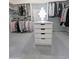 Organized walk-in closet with ample hanging space and built-in drawers for efficient storage at 14236 N 28Th St, Phoenix, AZ 85032