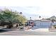 Charming single-story home with a three-car garage, red roof tiles, and manicured landscaping at 14236 N 28Th St, Phoenix, AZ 85032