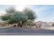 A charming single-story home features lush landscaping, creating a tranquil curb appeal at 14236 N 28Th St, Phoenix, AZ 85032