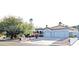 Beautiful exterior featuring a wide driveway leading to a two-car garage with a landscaped yard and mature trees at 14236 N 28Th St, Phoenix, AZ 85032