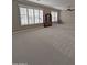 Spacious living area featuring large windows with shutters and neutral carpet at 14236 N 28Th St, Phoenix, AZ 85032