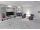 Cozy living room boasts a stone fireplace, built-in shelving, a ceiling fan, and comfortable seating at 14236 N 28Th St, Phoenix, AZ 85032