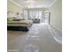 Generous main bedroom with a large bed, sitting area and access to the outdoor patio at 14236 N 28Th St, Phoenix, AZ 85032