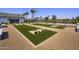 Community bocce ball court with benches and shade structures, offering a fun and relaxing outdoor activity at 14606 W Wood Dr, Surprise, AZ 85379