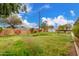 This property has a spacious backyard with mature landscaping and a block wall at 14608 N Montego Ct, Phoenix, AZ 85053