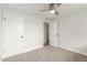 Bedroom featuring carpet, ceiling fan, and closet at 14608 N Montego Ct, Phoenix, AZ 85053