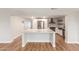 Bright modern kitchen featuring a quartz countertop island, stainless appliances, and a subway tile backsplash at 14608 N Montego Ct, Phoenix, AZ 85053