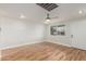 Spacious living room with hardwood floors, a ceiling fan, and natural light at 14608 N Montego Ct, Phoenix, AZ 85053