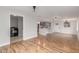 Spacious open-concept living space featuring updated flooring, recessed lights, and an open kitchen at 14608 N Montego Ct, Phoenix, AZ 85053