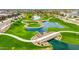 Community green space featuring ponds, walking paths, and lush landscaping from an aerial view at 1464 E Aris Dr, Gilbert, AZ 85298