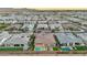 Panoramic aerial view showcases this home with its exceptional backyard pool, outdoor fire pit, and desert landscape at 1464 E Aris Dr, Gilbert, AZ 85298