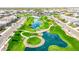 Aerial view of a neighborhood featuring water features, green spaces, and walking paths at 1464 E Aris Dr, Gilbert, AZ 85298